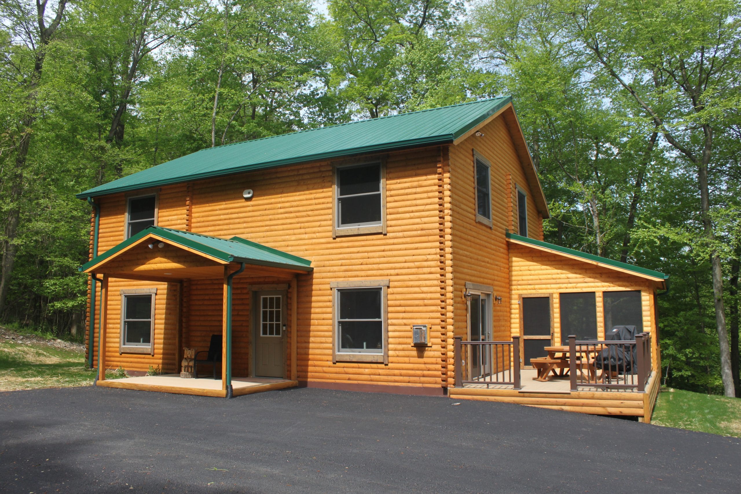 bear den log home front